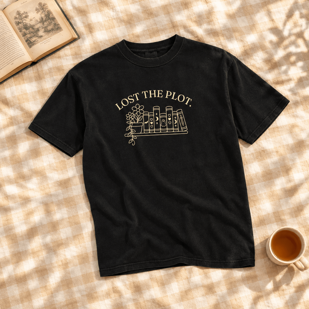 Lost the Plot black tee on gingham with a book and tea cup