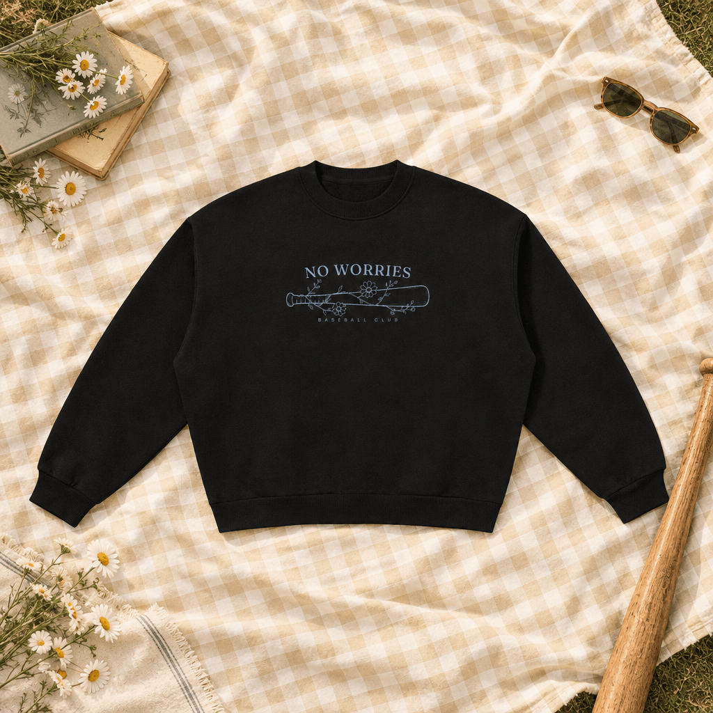 No Worries Baseball Club crewneck flat lay with a wooden baseball bat